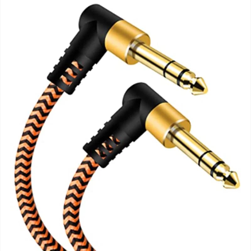 Cabo de instrumento de 1/4 polegada com conectores jack de 6.35mm dourados e pretos, padrão ziguezague laranja e preto, fundo branco.