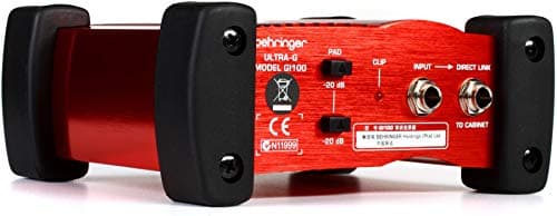 Caixa direta ativa Behringer GI100 vermelha com controles e botões visíveis.