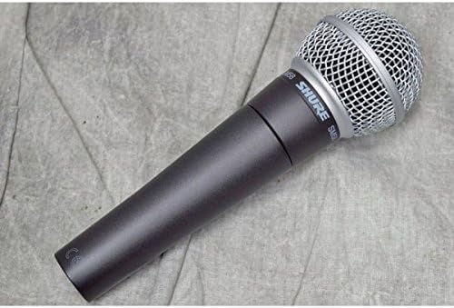 Microfone Shure SM58S dinâmico cardióide preto com botão liga/desliga em superfície cinza