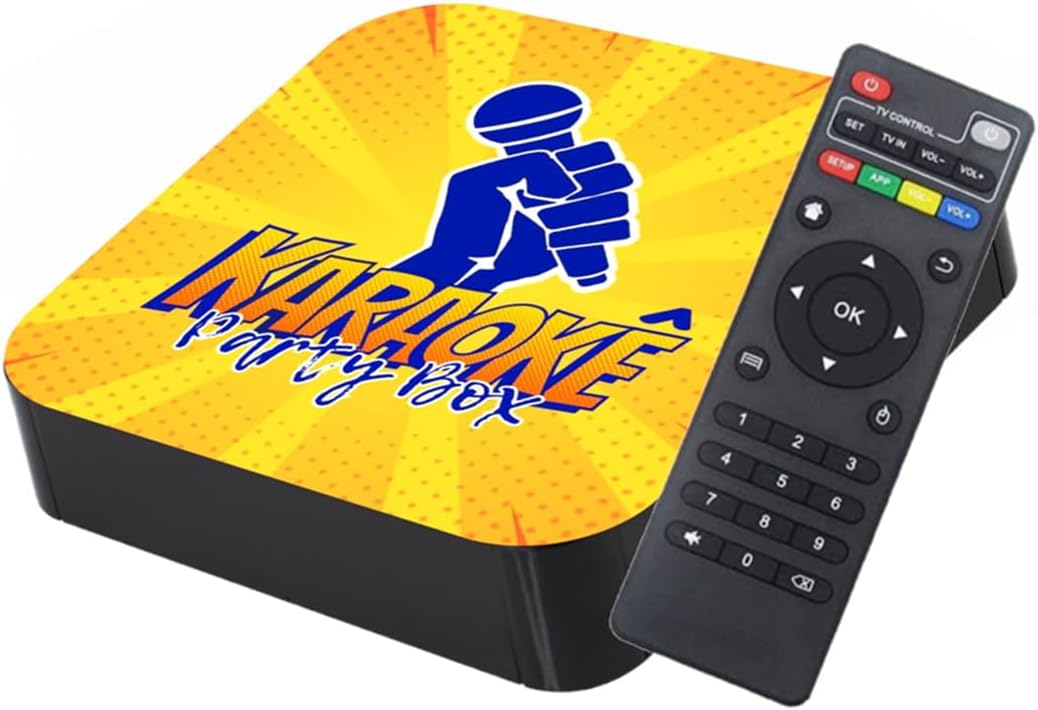 Caixa de karaoke com tampa amarela e controle remoto preto.