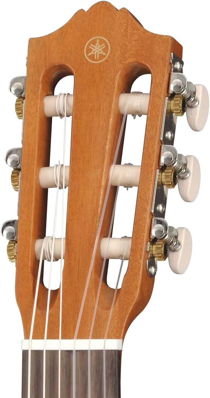 Cabeça da Yamaha GL-1 Guitalele com logo Yamaha, cravelhas metálicas e cordas de nylon.