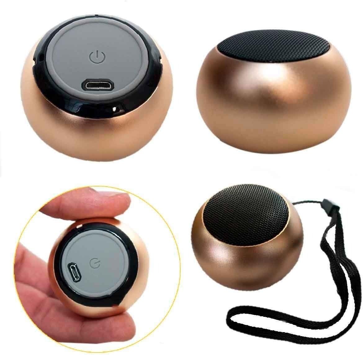 Caixinha de som portátil Bluetooth Feitun Fn-0006 cor dourada, formato arredondado, botão ligar e porta micro USB visíveis.