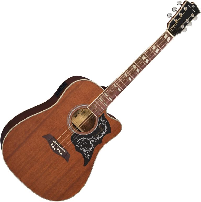 Violão elétrico Michael Galaxy Folk com Cutaway e corpo em mogno, tampo e laterais marrom, escudo decorativo, cordas douradas e tarraxas cromadas.
