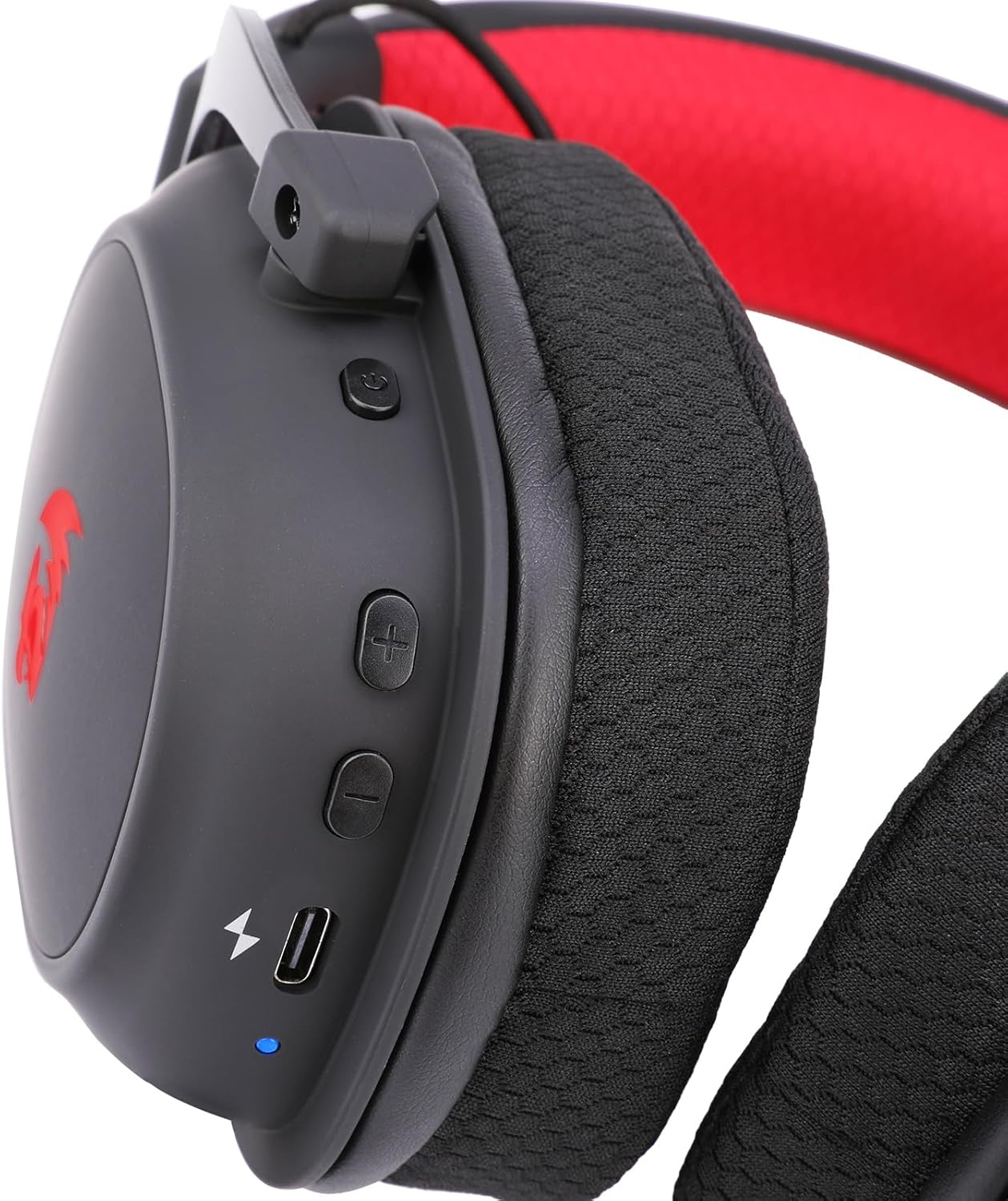 Close-up of control buttons and USB-C charging port on Redragon Zeus Pro wireless gaming headset left ear cup